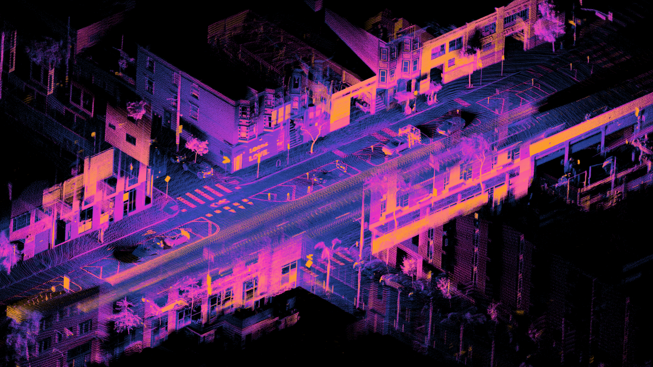 Colored LiDAR point cloud of a street intersection captured from a moving car